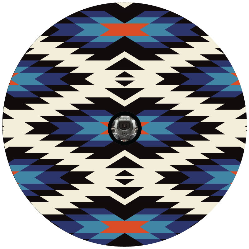 Burnt orange, black, blue shades, and white geometric Aztec serape pattern spare tire cover design with a center hole to accommodate a backup camera.