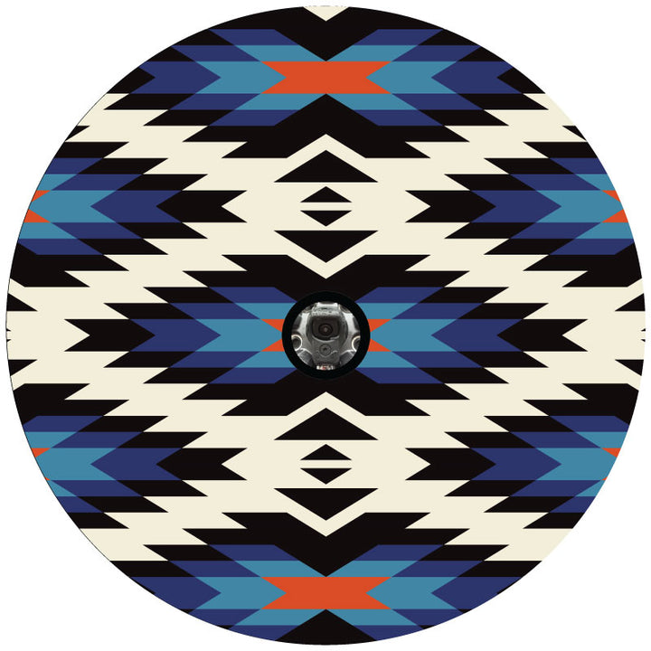 Burnt orange, black, blue shades, and white geometric Aztec serape pattern spare tire cover design with a center hole to accommodate a backup camera.