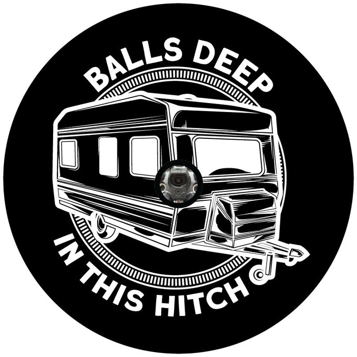 Mockup example of an RV spare tire cover design that has a travel trailer camper graphic in the center and a funny play on words with the says "balls deep in this hitch" curved on the out top and bottom plus a hole in the middle to accommodate a vehicle that has a backup camera in their spare wheel.