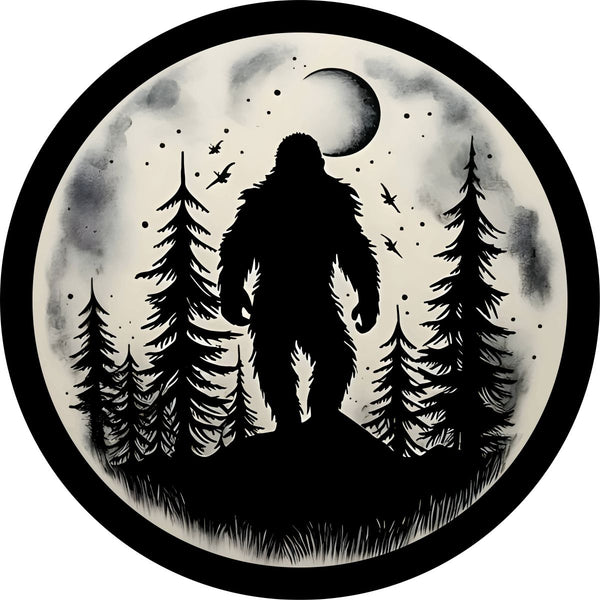 Sasquatch spare tire cover design with a silhouette of bigfoot walking through the forest under the full moon