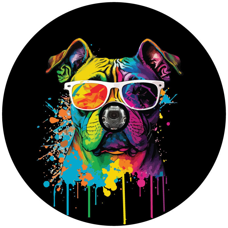 Mock up design of a black vinyl spare tire cover with a hole cut for a backup camera featuring a multicolor pop art style painted English Bulldog wearing sunglasses and paint dripping and splattered.