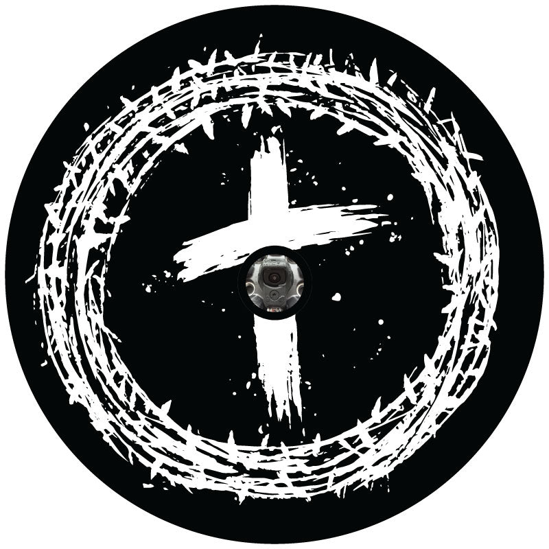 Mockup example of a black vinyl spare tire cover with a Jesus crown of thorns on the outside and a paint brushed cross with backup camera hole