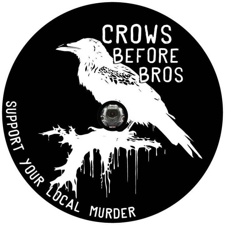 A mock design for a spare tire cover of a crow silhouette and a saying that says crows before bros, support your local murder for any kind of Jeep, Bronco, RV, Camper, Motorcoach or any other spare tire cover for any vehicle with a backup camera in the spare wheel. 