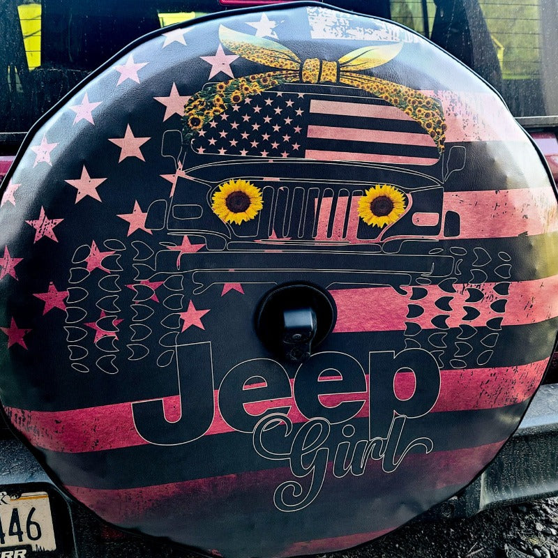 Live look at a custom spare tire cover design of a vinyl spare tire cover with pink ombre, American flag background, Jeep Wrangler wearing a sunflower head band, American flag windshield, and sunflower headlights, with the words Jeep Girl on the bottom.