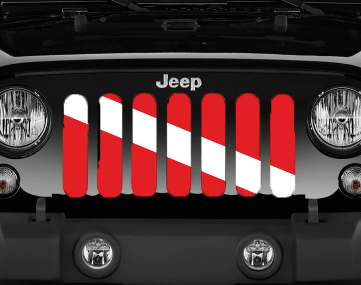 Close up look at a scuba diver down flag Jeep grille insert displayed on a black Jeep Wrangler