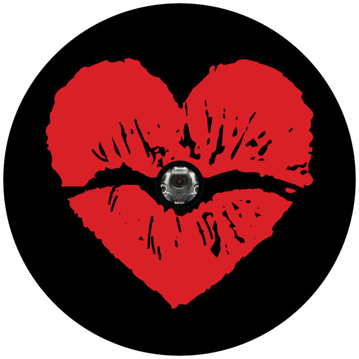 Mock up sample design of a black vinyl spare tire cover with big red lipstick kiss imprint in the shape of a heart with a hole for a back up camera.