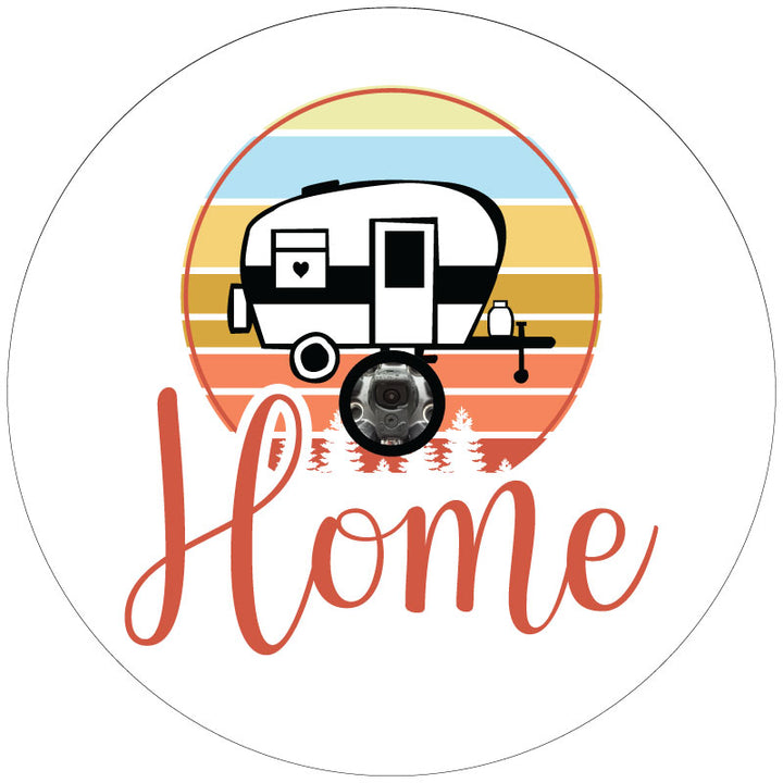 White vinyl spare tire cover for RVs and campers with backup cameras, the image is of a small camper graphic and the word Home written in a creative font embedded into the design.