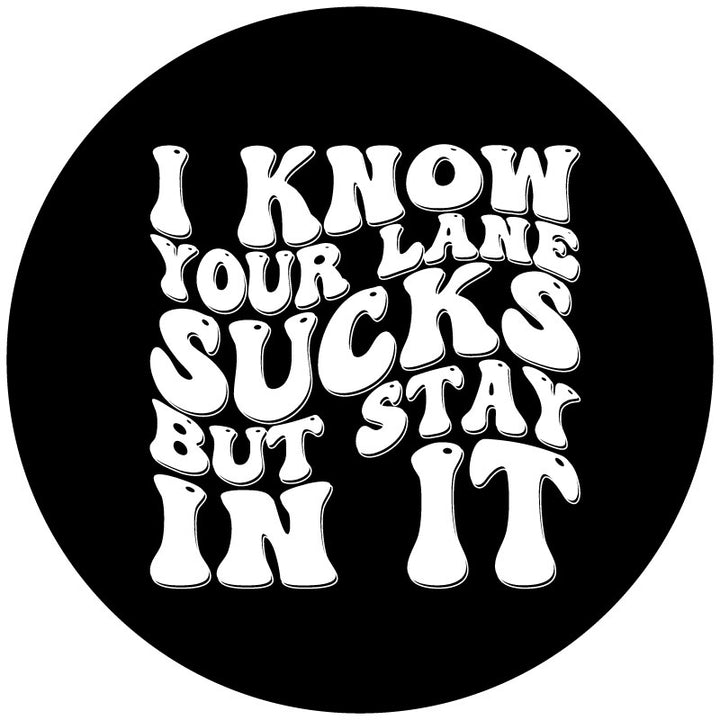 Mockup graphic design for a black vinyl funny spare tire cover that says, "I know your lane sucks but stay in it" in big, bold, retro designed lettering. 