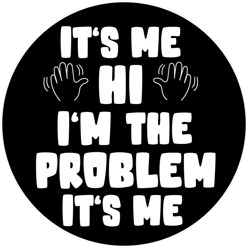 Black vinyl spare tire cover with white text of the Taylor Swift song lyrics, It's Me. Hi. I'm The Problem It's Me and two hands waving