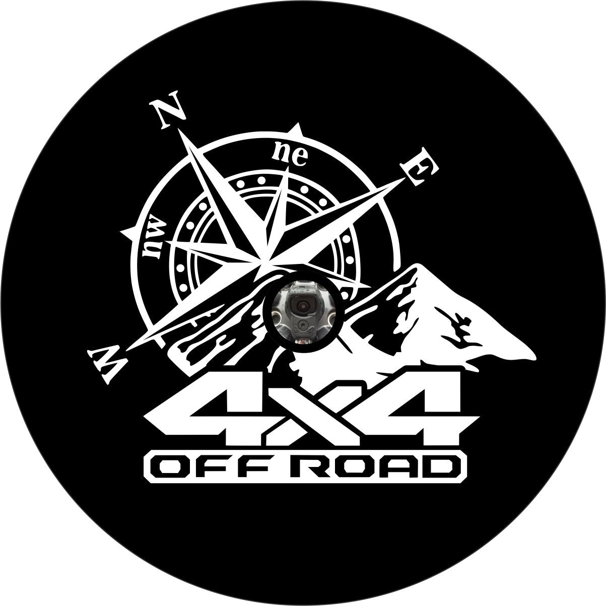 A spare tire cover design of a large compass, mountains, and the saying 4x4 off road across the bottom with a hole for spare wheels that have a backup camera installed