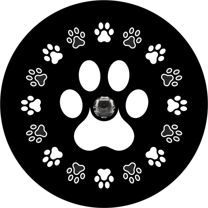 Spare tire cover design of a wreath of dog paws or a circle of small dog paws around one large dog paw with a hole for a backup camera