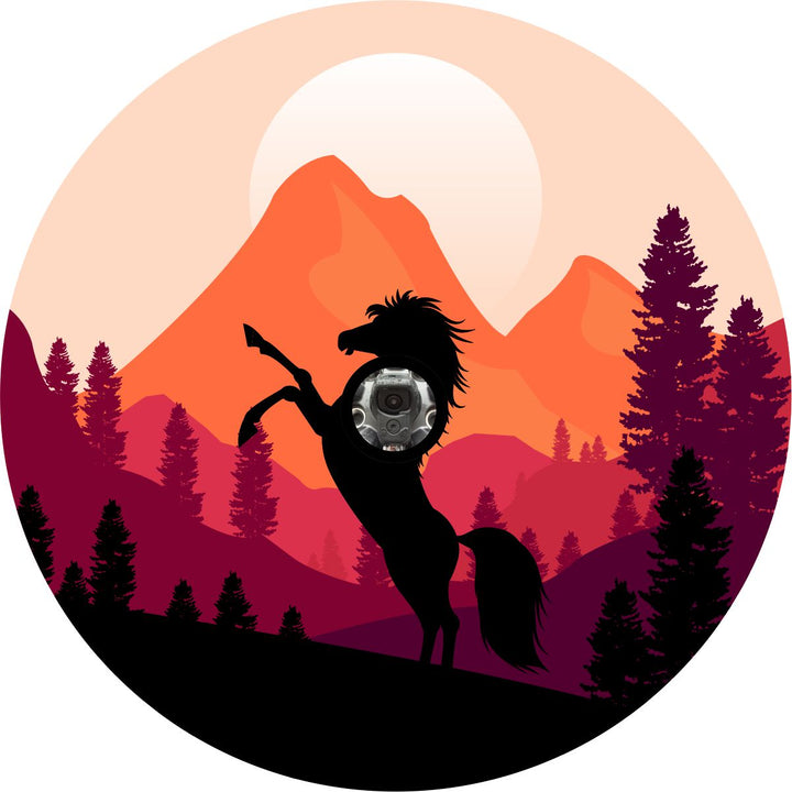 Beautiful orange and purple colored mountain background with a black wild mustang horse on its hind legs looking wild and free design on a spare tire cover for any Jeep, Bronco, RV, camper, or any other vehicle with a spare wheel that has a backup camera.