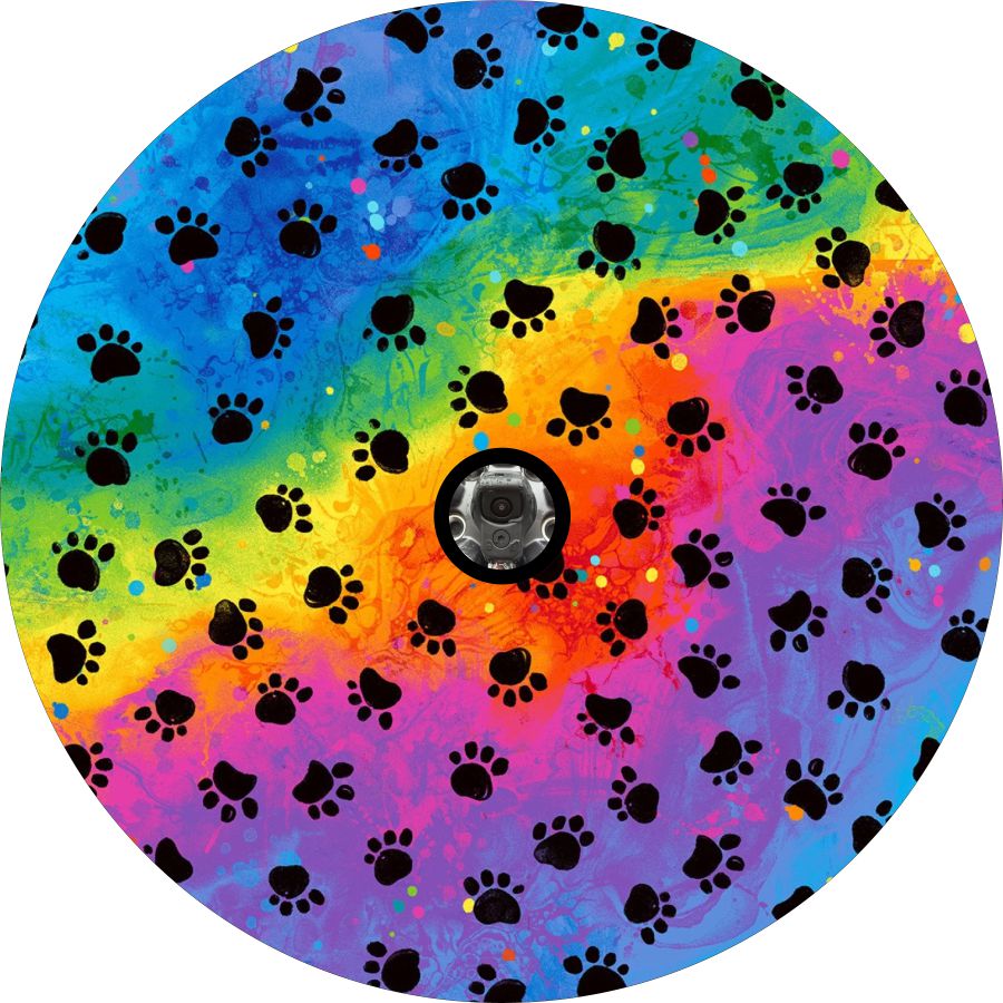 Bright and beautiful rainbow colored painted design with blue, pink, green, yellow, orange, red, and purple colors behind dog paw pattern spare tire cover design for any vehicle with a spare wheel in need of covering that would have a back up camera and need the hole to fit the camera.