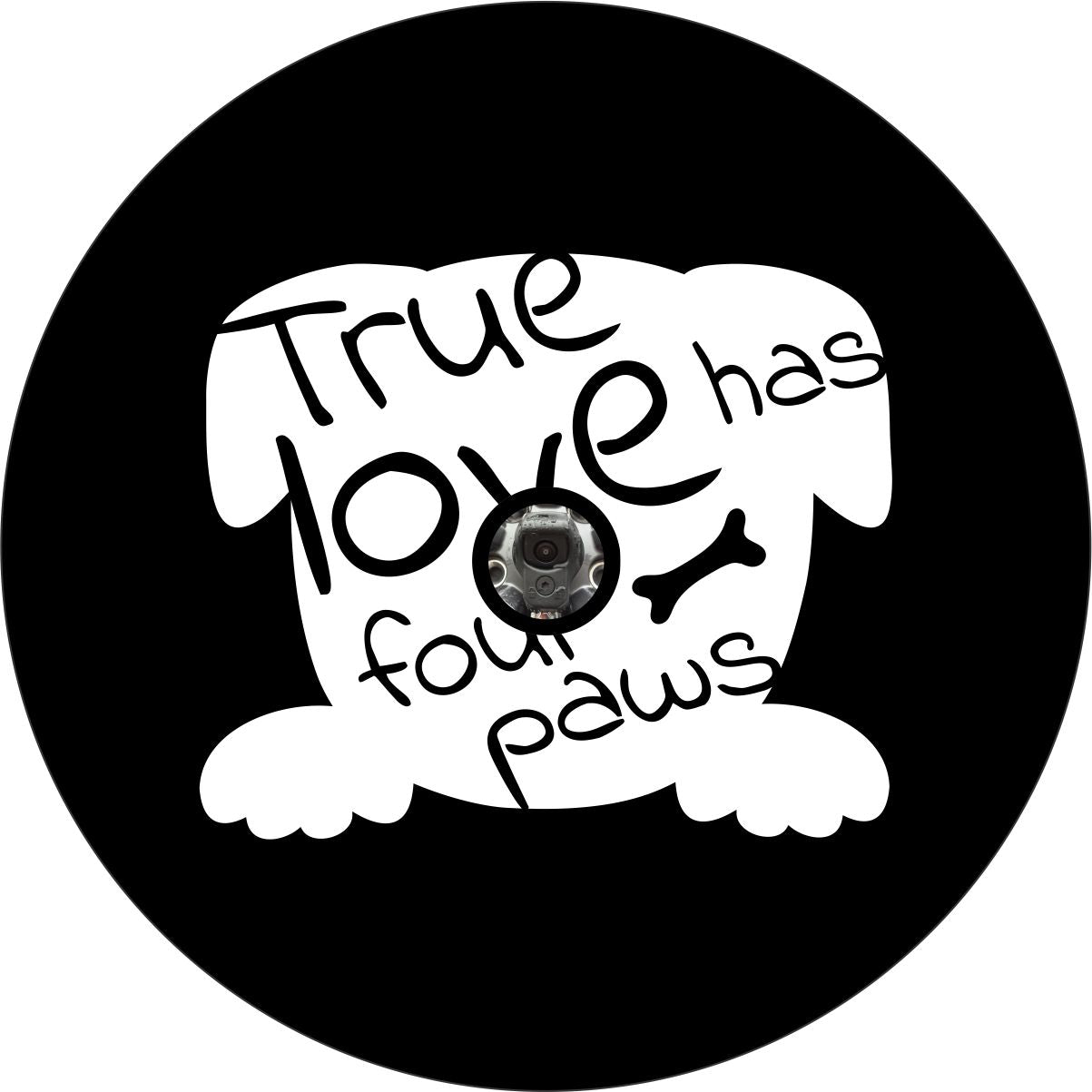 White silhouette of a dog head and paws with the text true love has four paws written within it as a spare tire cover design on black vinyl and a camera hole for vehicles with a backup camera on their spare wheel