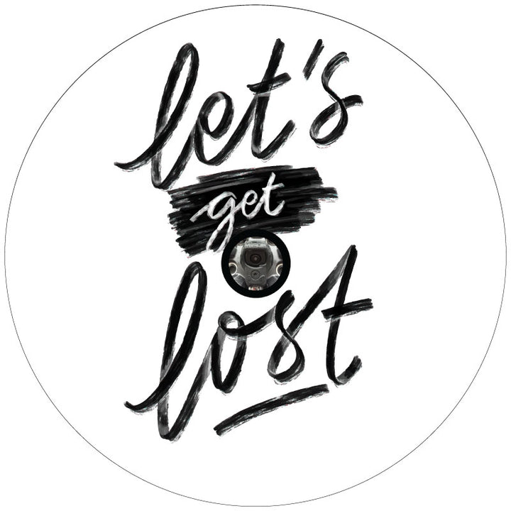 A mockup design of a white vinyl spare tire cover handwritten that says "Let's Get Lost" in cursive font in black with a hole to accommodate a spare tire that has a backup camera in the center.