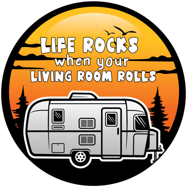 Graphic of a spare tire cover for RV, camper, trailers, and more. Design says life rocks when your living room rolls and has an orange and yellow sunset background with trees and a RV travel trailer graphic.