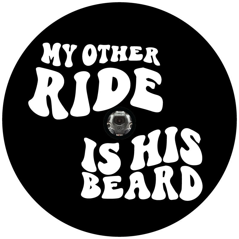 Black circle spare tire cover mock up with funky retro lettering that reads, my other ride is his beard. Funny spare tire cover design created with a space for a hole for spare wheels that have a backup camera. 