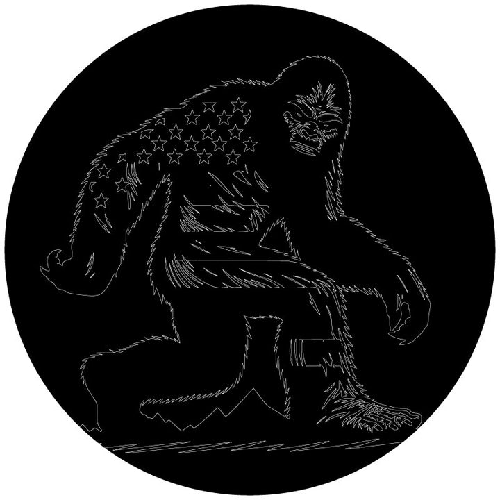 An outline sketch of a fierce looking sasquatch bigfoot spare tire cover design with the American flag drawn into the design to look a part of the body. 