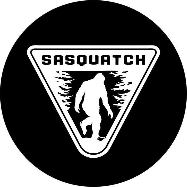 Mock up for a black vinyl Sasquatch spare tire cover design. White upside down triangle sign with a bigfoot silhouette and the work Sasquatch across the top.