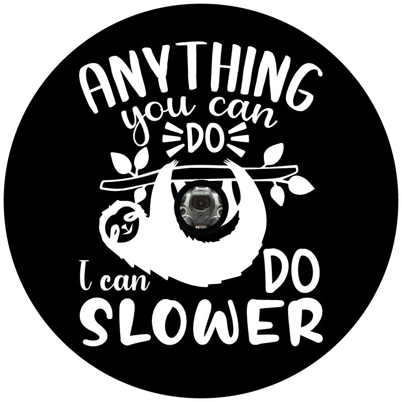 Mock up design of a black spare tire cover and a white graphic design of a sloth and the saying anything you can do I can do slower with a hole space for a back up camera
