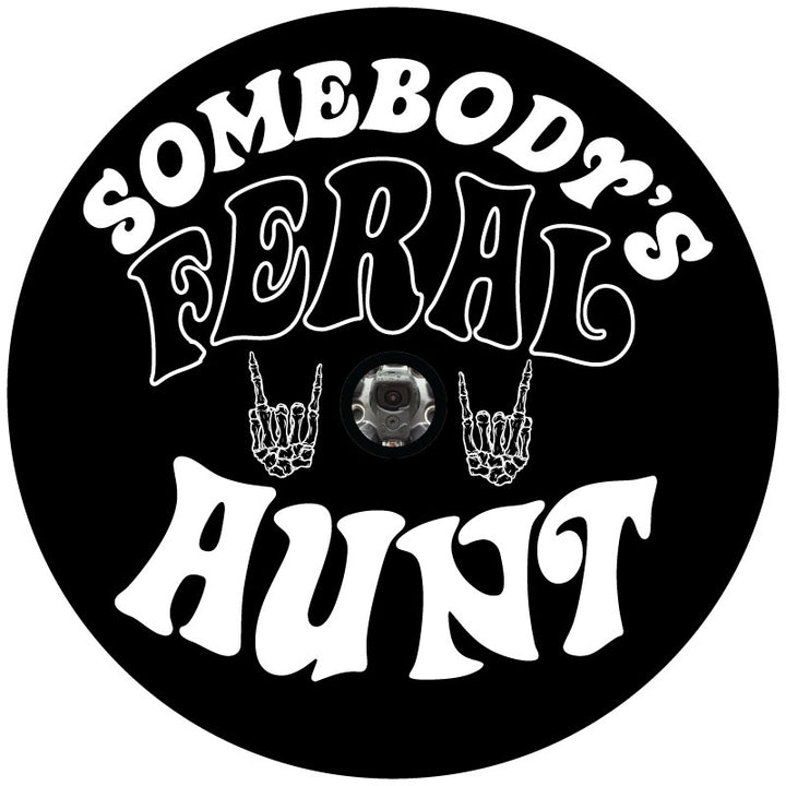 Mock up image of a spare tire cover design that says Somebody's Feral Aunt and a skeleton hand giving the universal rock on symbol plus a center hole for a backup camera.