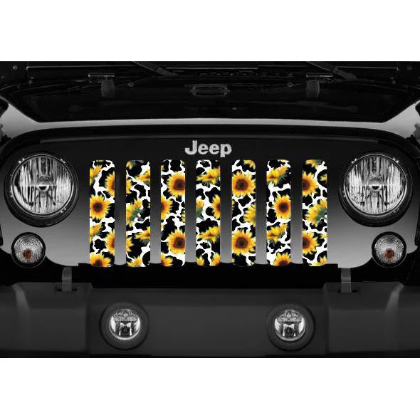 close up view of a Sunflower and cow print patterned Jeep grille insert design on a black Jeep Wrangler