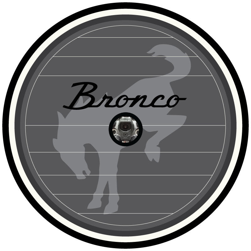 Gray, black, and white vintage Ford Bronco spare tire cover design with Bronco watermark and the Bronco vintage logo and cut for a backup camera