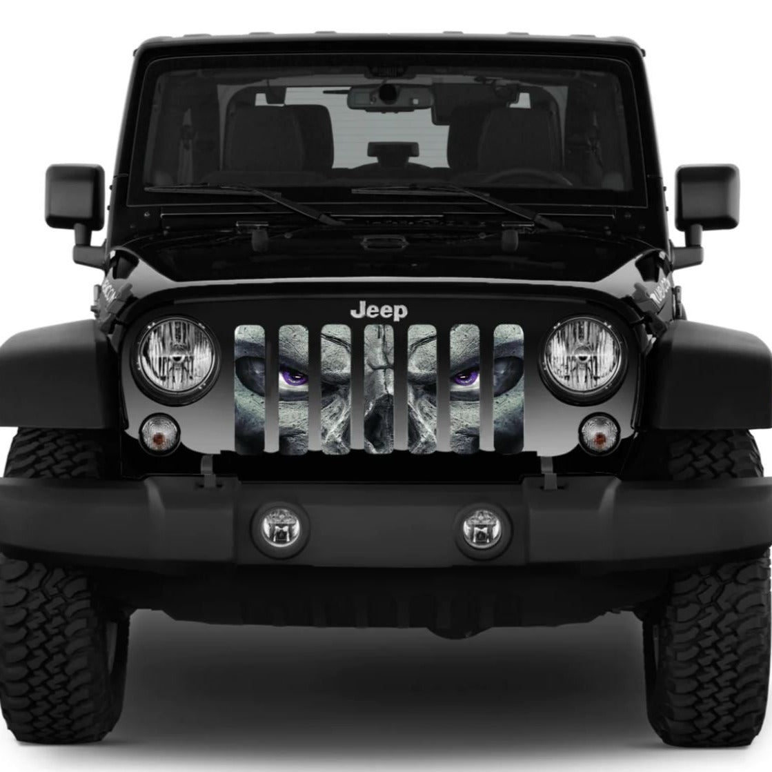 Black Jeep Wrangler showing a Jeep grille insert design of a skeleton face with purple eyes watching you. 