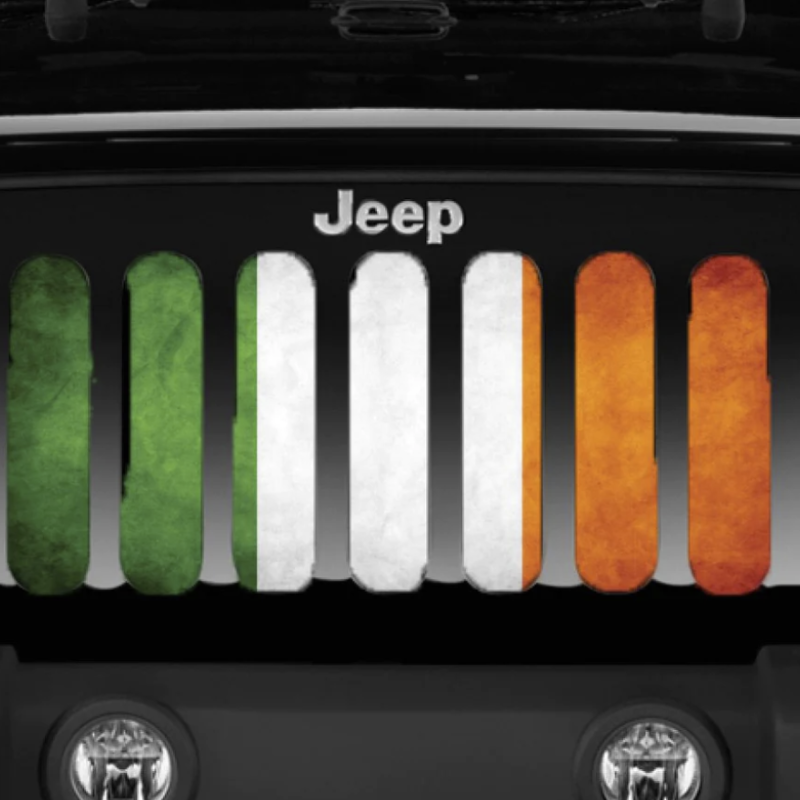 Close up image of an Irish flag design on a Jeep grille insert displaying on a black Jeep Wrangler.