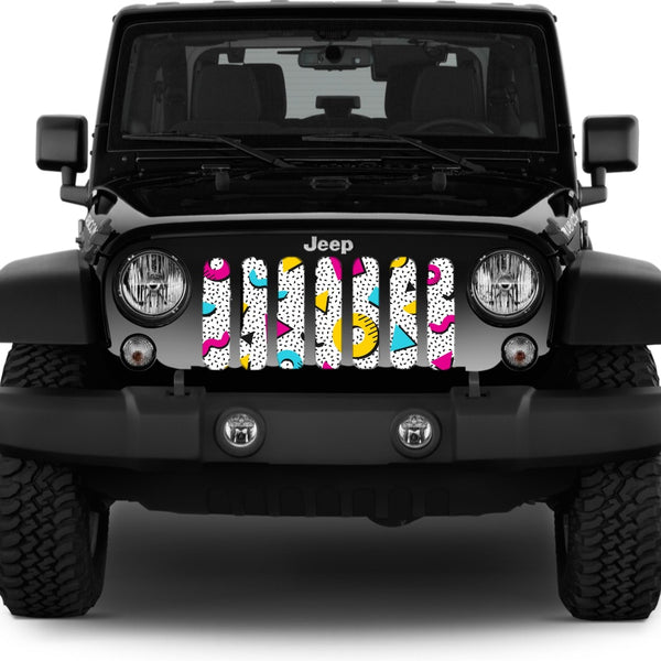 Jeep grille insert inside a black Jeep Wrangler of a 90's retro Saved by the Bell pattern with shapes and bright colors of pink, yellow, and blue