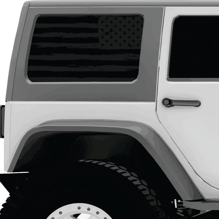 Rustic dark gray American flag decal window cling on a white Jeep Wrangler's back window.