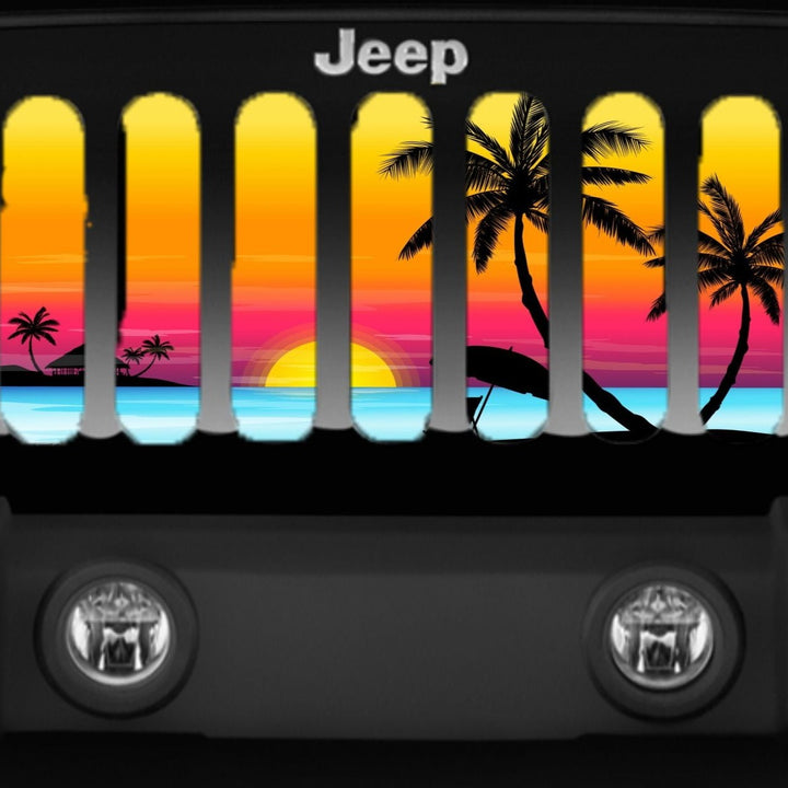 Close up view of Jeep grille insert on a black Jeep Wrangler of a beautiful colorful tropical island beach scene sunset and palm tree