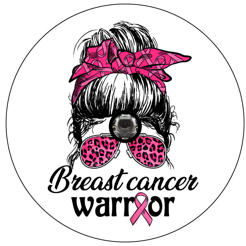 Spare tire cover for campers, RV, Jeep, Broncos, trailers, and more. Design is a silhouette of a girl with a messy bun top knot and a breast cancer pink ribbon hair ribbon with pink leopard sunglasses plus the words breast cancer warrior for white vinyl spare tire cover and a Jeep spare tire cover with camera hole.