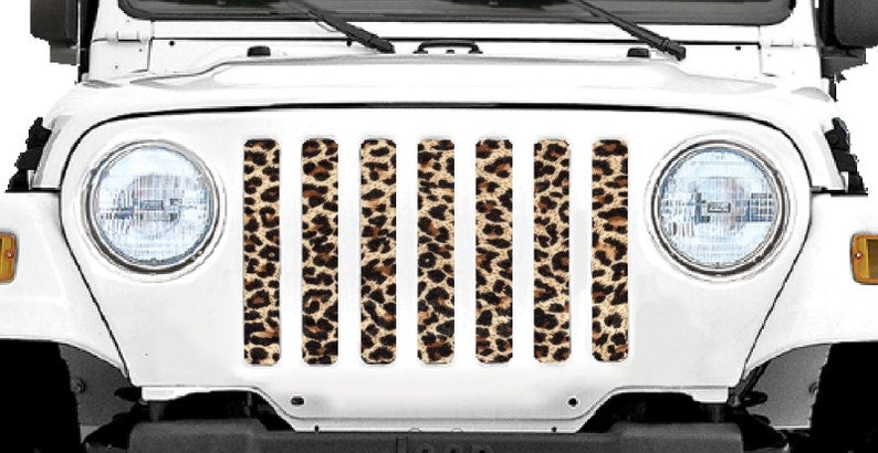 Cheetah print mesh grille insert for Jeep shown with white jeep