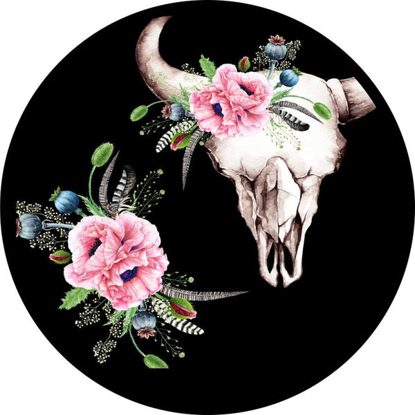 a life like bull or cow skull decoated with pink florals and other green bits and feathers