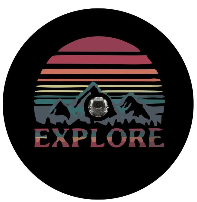 The word explore below a landscape silhouette of mountains and the sky or sun with layered jewel tones spare tire cover for campers, RV, Jeep, Broncos, and more  on black vinyl with a JL backup camera