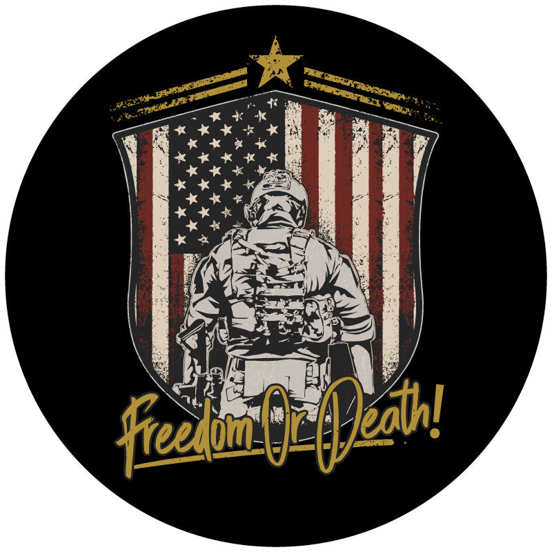 American flag insignia with a silhouette of the back of a soldier in front of the flag with the saying Freedom or Death in script on a black vinyl spare tire cover for Jeep, Bronco, RV, Camper, Van, and more