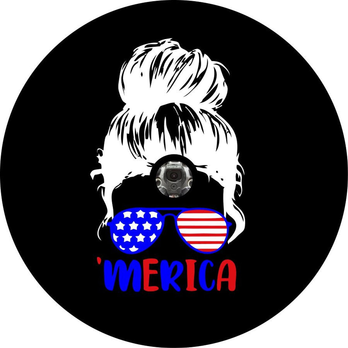 Silhouette of a girls head with a messy bun wearing sunglasses that are patriotic colors red, white and blue like the American flag and the word 'merica underneath in blue and red spare tire cover design for a black vinyl spare tire cover for Jeep, Bronco, RV, Camper, and more. Design is made for a tire cover in need of a back up camera