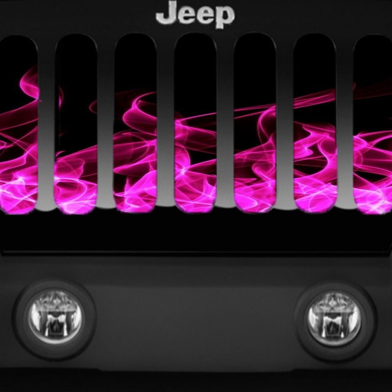 Close up of a Tuscadero pink fire flames grille insert for Jeep on a black Jeep Wrangler