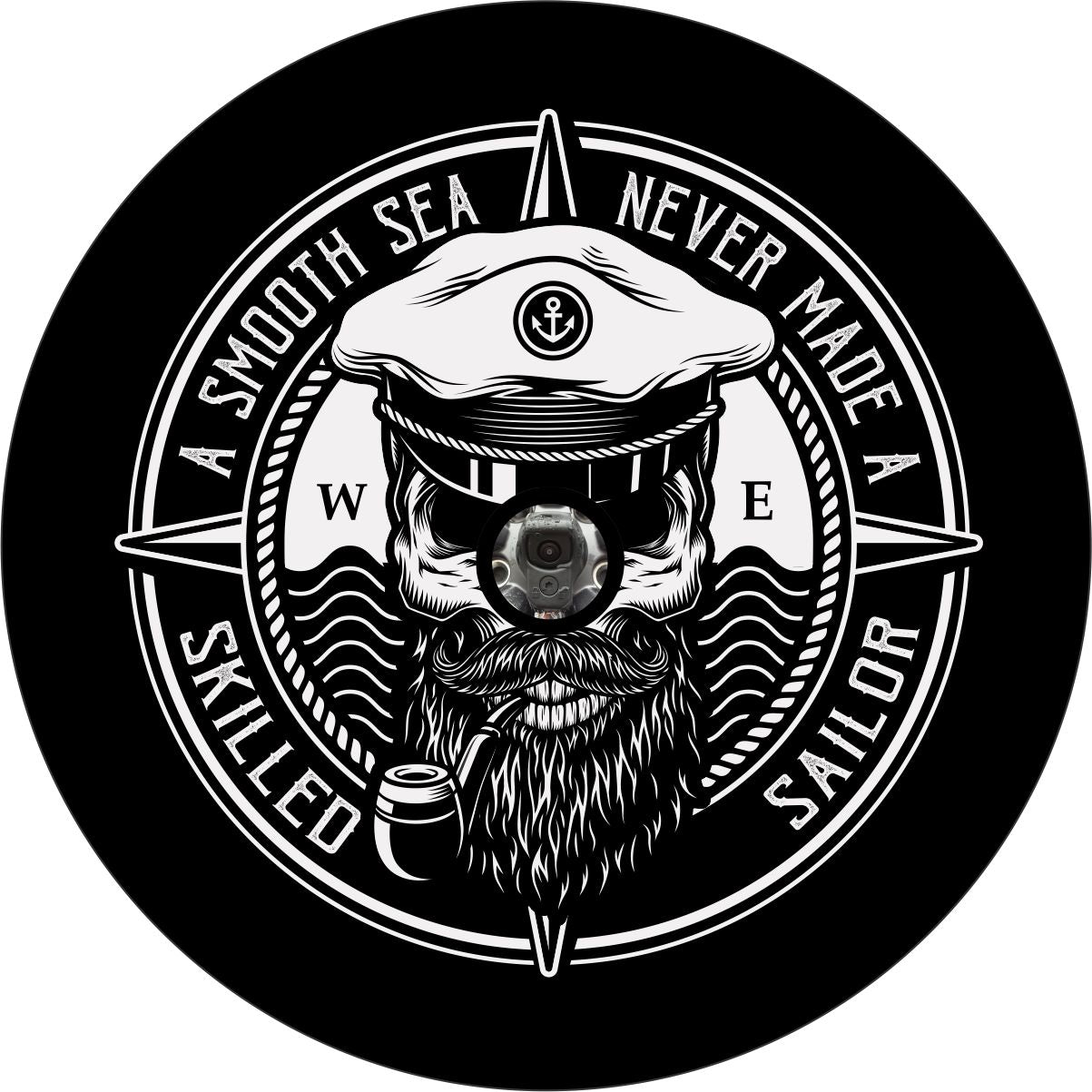 Unique spare tire cover design with a skull wearing a captains hat smoking a pipe and a compass style background with the saying a smooth sea never made a skilled sailor on the edge. Custom wheel cover is designed to accommodate spare tires with a back up camera. 