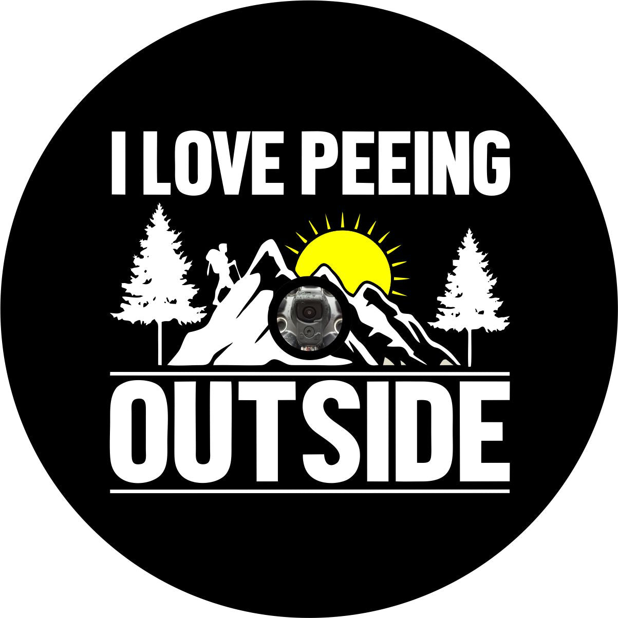 Funny spare tire cover design for wheels with a back up camera. Black vinyl spare tire cover with the silhouette of the mountains and a hiker with the saying I love peeing outside.