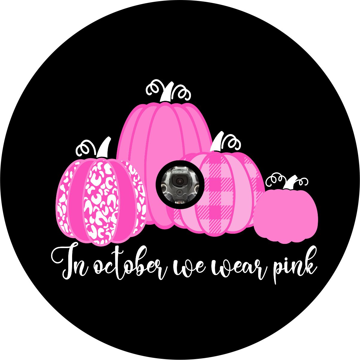 Spare tire cover with camera hole of four pink pumpkins designed with the saying in October we wear pink spare tire cover on black vinyl for Jeep, RV, Camper, Bronco and more