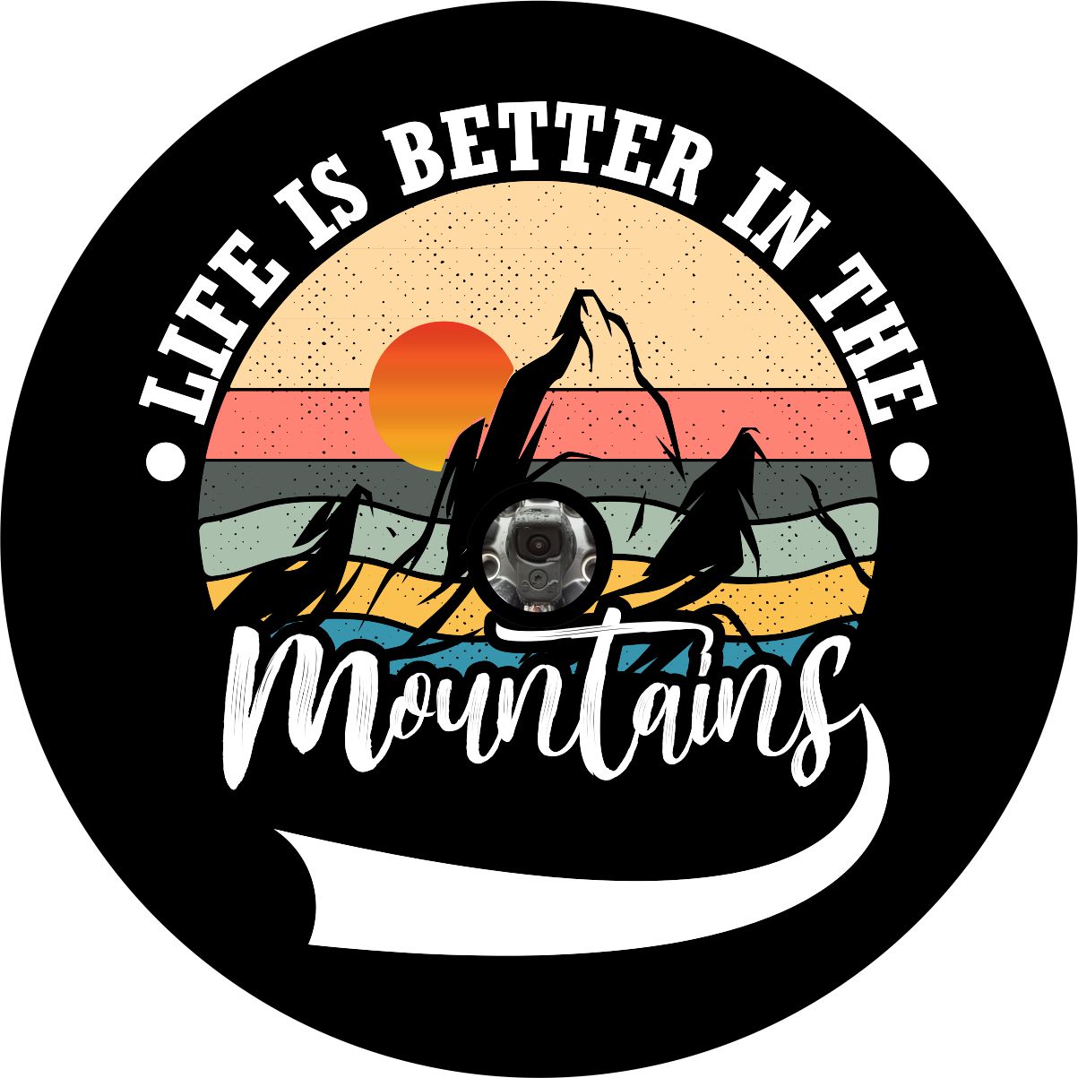 Creative and colorful spare tire cover on black marine-grade vinyl of mountain silhouette and a sunset with the saying, "life is better in the mountains" around the outer edge. Tire cover design for a back up camera.
