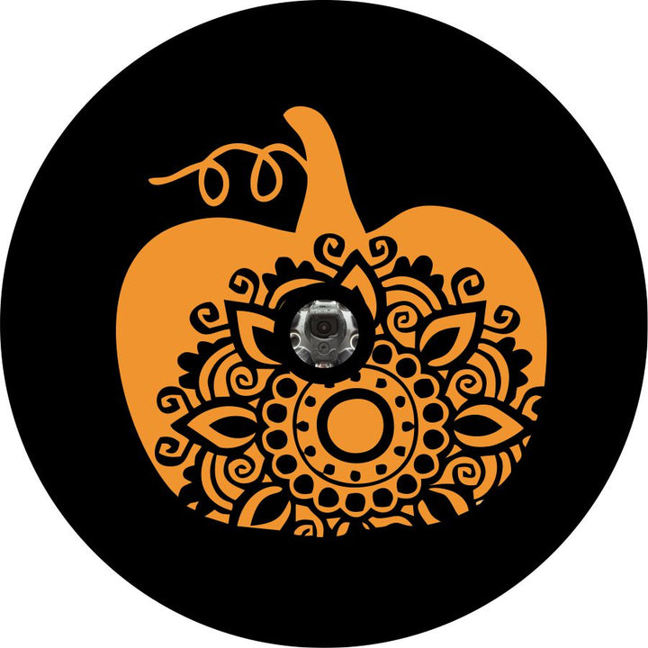 Orange pumpkin silhouette and a mandala design inside as a design for a spare tire cover for a Bronco, Jeep, RV, camper, sprinter van, and more plus a back up camera space.