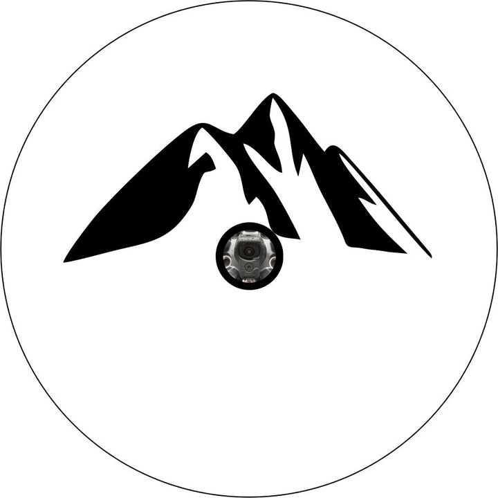 Mockup design of a white vinyl spare tire cover with a camera hole for an RV, camper, Jeep, trailer, Bronco, van, motorcoach or any other vehicle with an external spare wheel that has a backup camera. Design is a simple mountain silhouette graphic