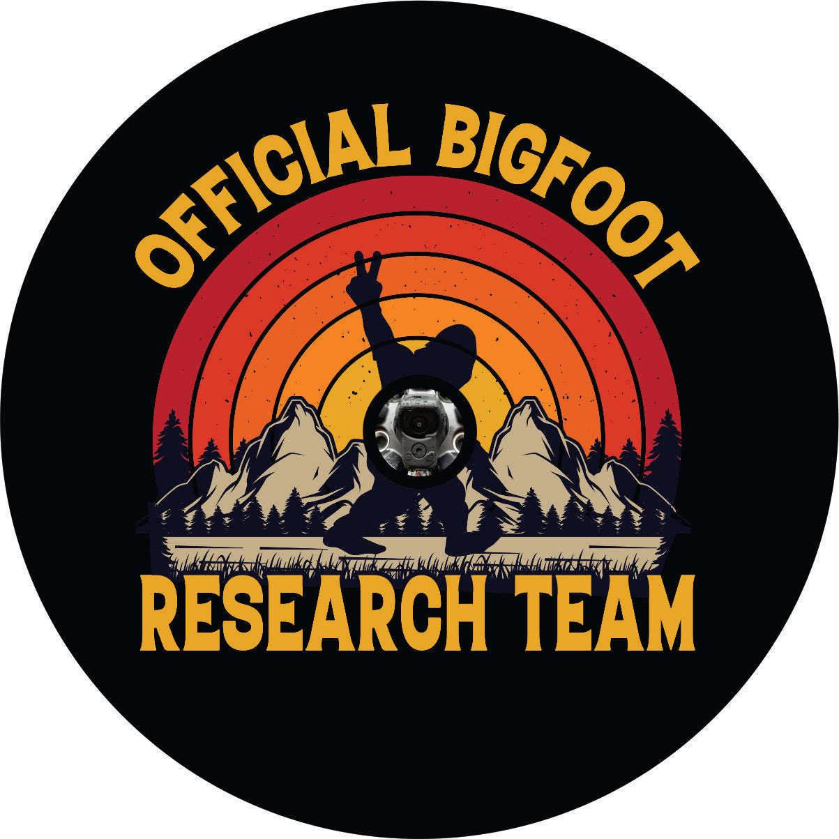 Sasquatch spare tire cover with for back up camera for Bronco, Jeep, RV, camper, and more with Bigfoot throwing out the peace sign as he walks along with mountains in the back and an ombre colored sunset. With the words, "official bigfoot research team"