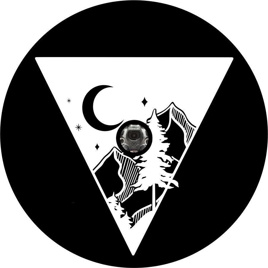 An upside down triangle with a graphic of a mountain peek the moon and a tree for a black vinyl spare tire cover for Jeep, Bronco, etc.  design is made for a spare tire cover in need of a back up camera