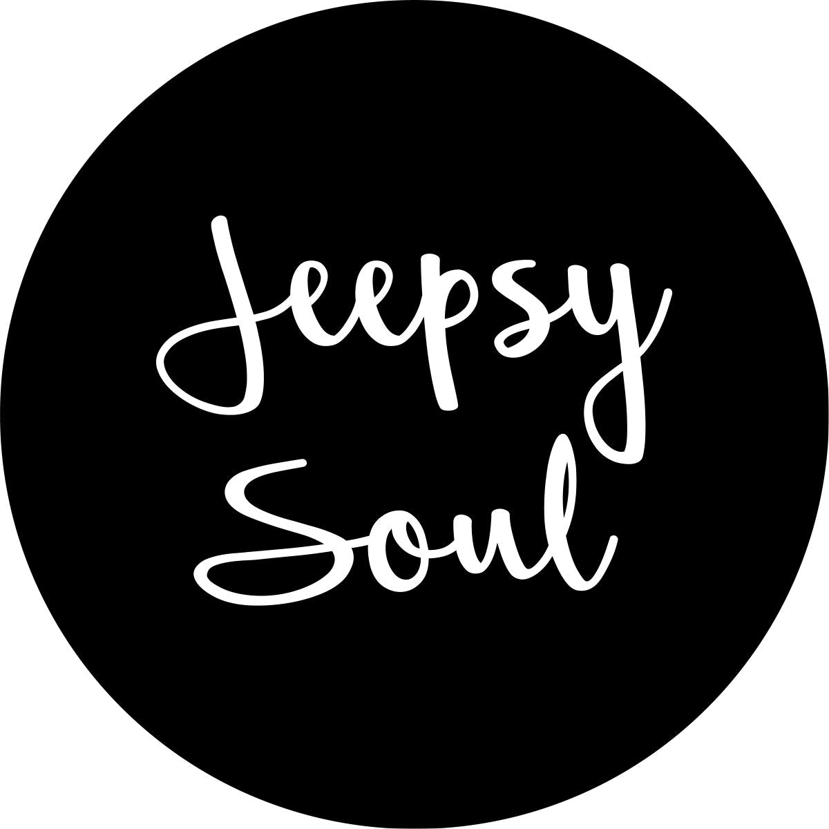Jeepsy Soul script font written across a black spare tire cover for Jeep