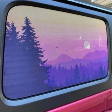 Purple shades at sunset or sunrise over the mountains and forest Jeep Wrangler window decal sticker.