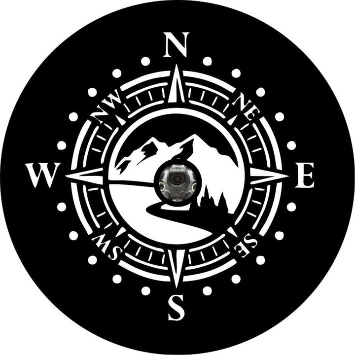 Mock up spare tire cover design for spare wheels with a back up camera on black vinyl. Design is a mountain road with a compass.